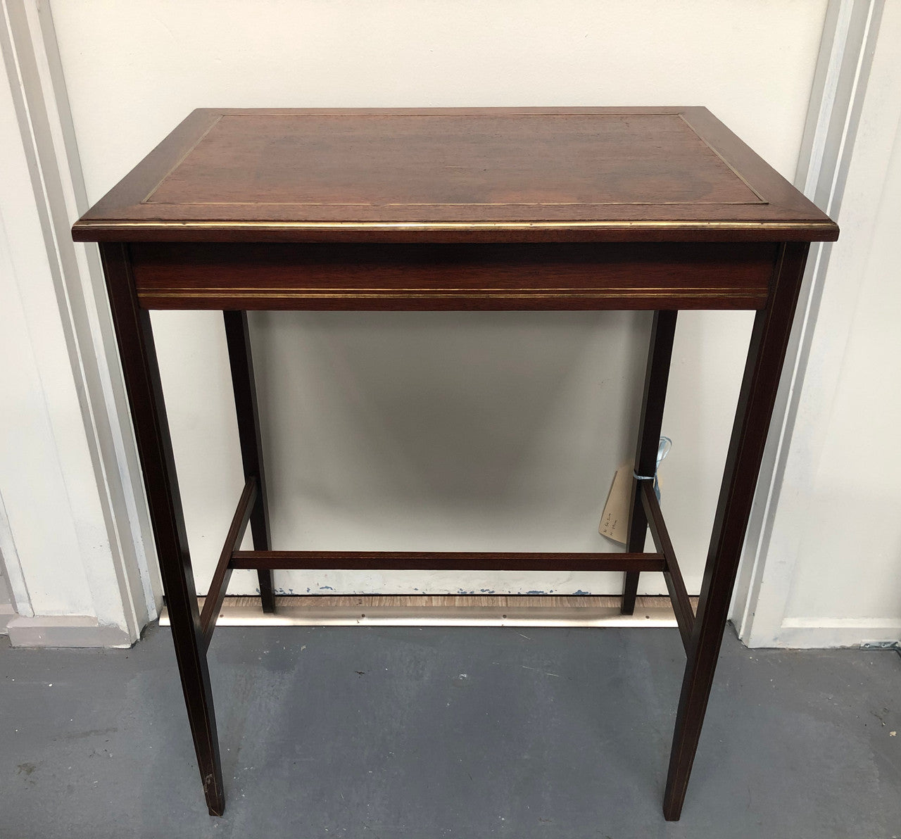 Elegant rectangular mahogany French brass inlaid occasional table. Is in good original condition.