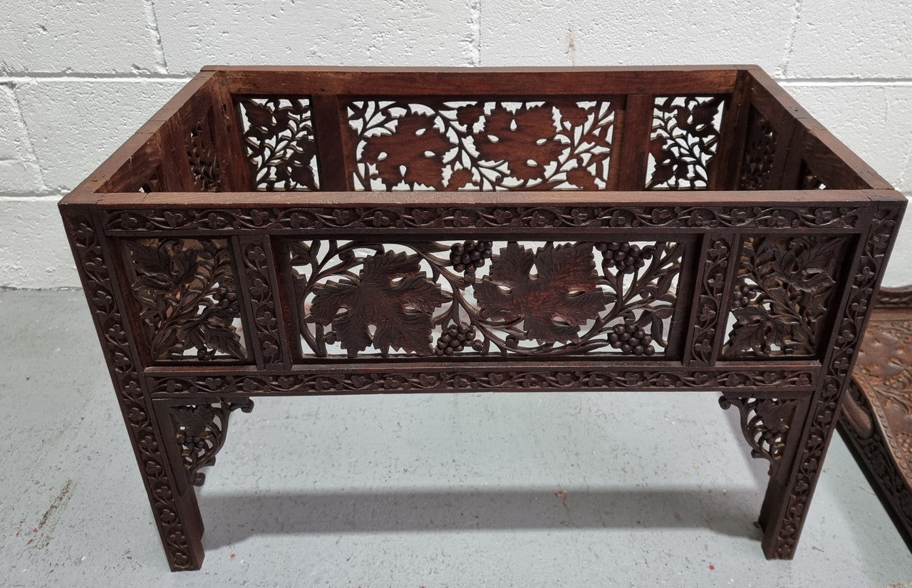 Anglo Indian folding occasional table with lift-up tray top. The tray has brass inlay and ornate carvings. The bottom of the table folds down and it is in good original condition.