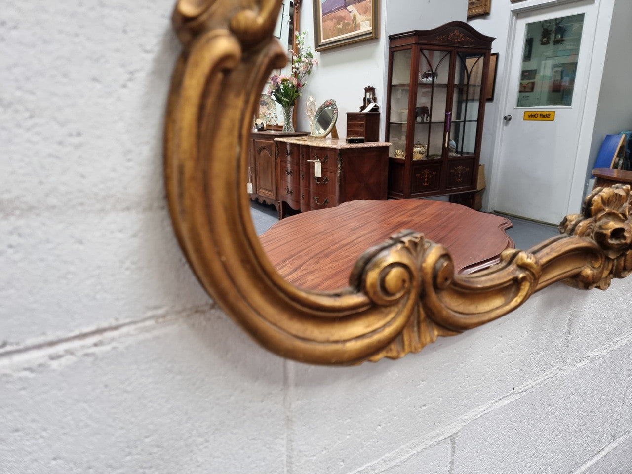 French Louis XV style wood carved and gilded mirror. Mirror is original and showing signs of age. It has been sourced from France and in good original condition.