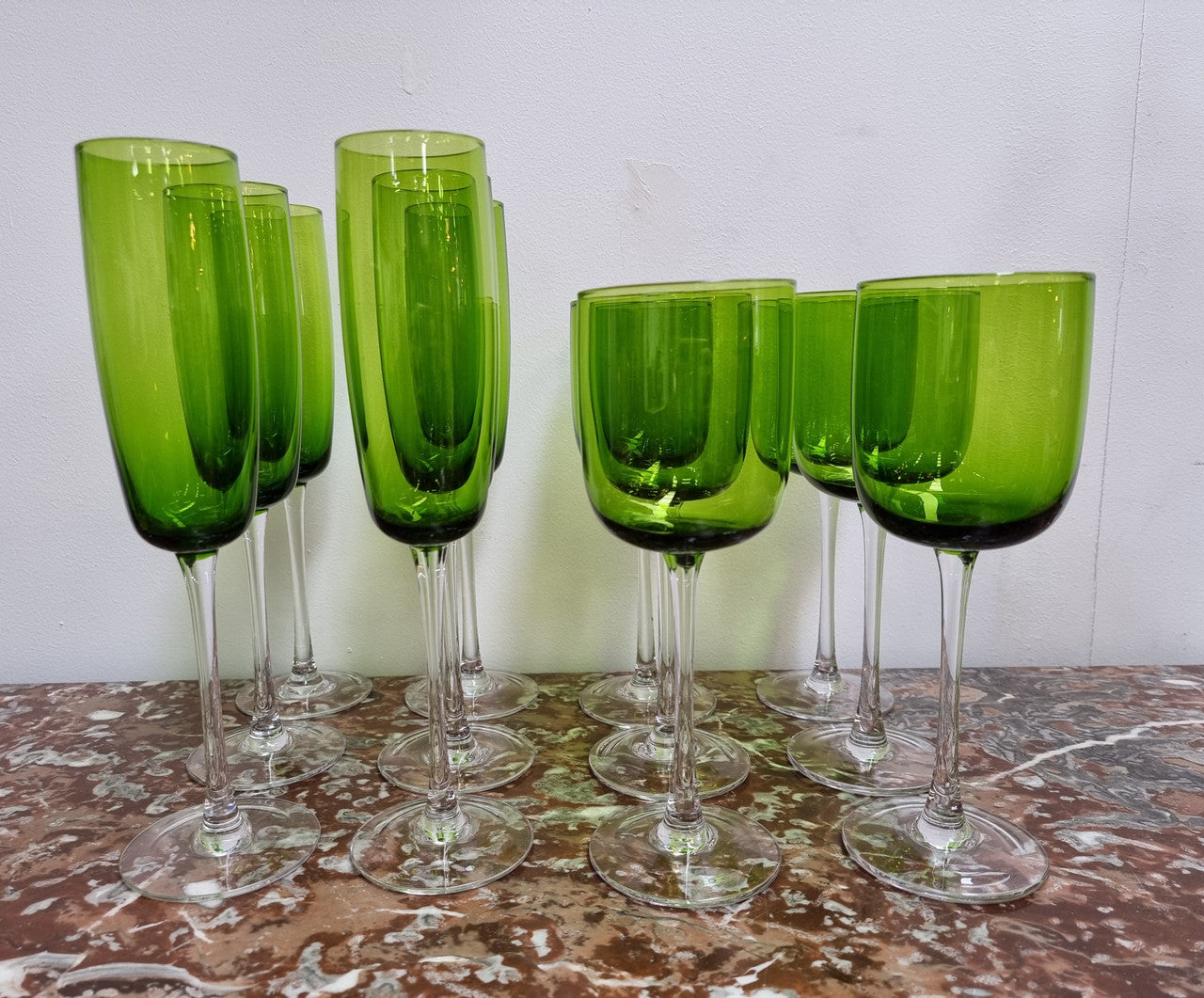 Beautiful set of 12 Vintage emerald green hand made wine glasses. Possibly Italian or French. They are in good original condition with no chips or cracks.