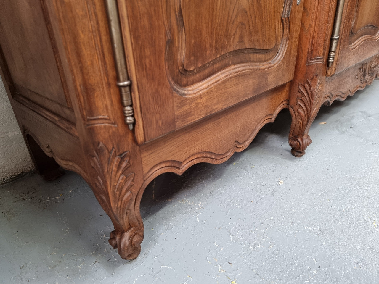 Parquetry top French oak Louis XV style sideboard with two draws and four cupboards. In good original detailed condition.
