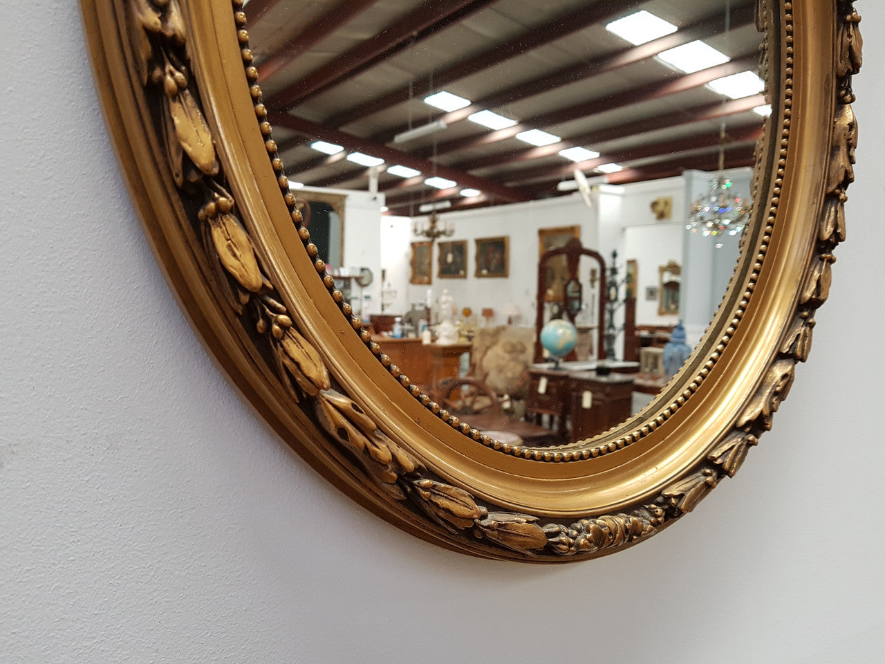 Antique French Gilt Oval Shape Mirror With Ribbon Crest