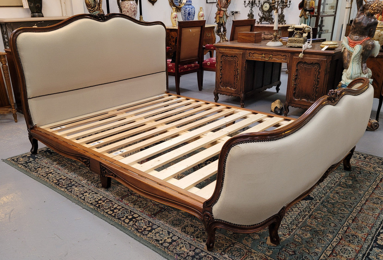 French Louis XV style queen size upholstered bed. Upholstery is in good condition and bed is complete with custom made slats. Just place your mattress on top.