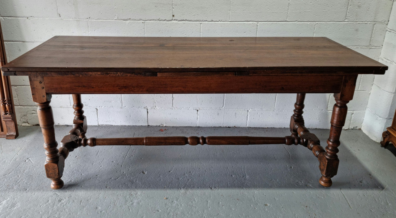 Appealing and rare French Oak Farmhouse extension table. Charming character to the top and comfortably seats 12 people. In good original detailed condition.