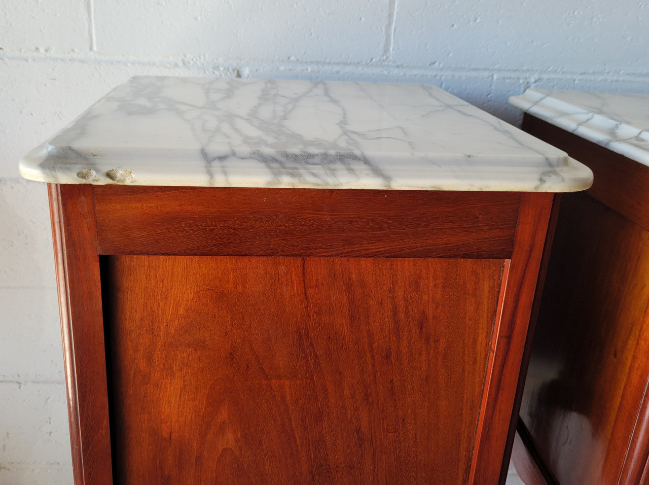 Pair of Louis XV style Walnut bedside cabinets marble top. Circa 1900 and in good original detailed condition.