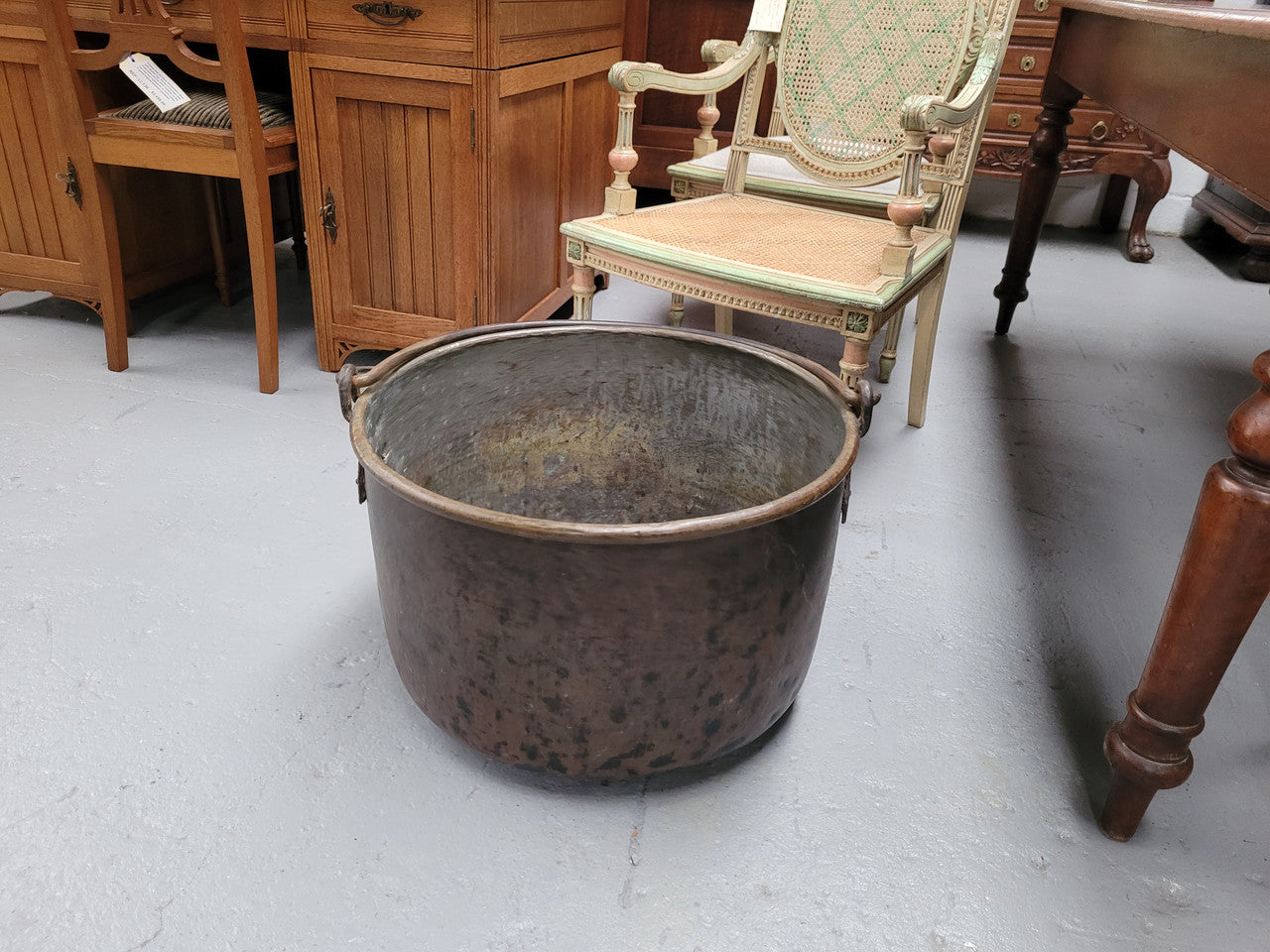 Sourced in France is this large Antique French brass firewood pot with handle. It is in original condition with some signs of wear please view photos.