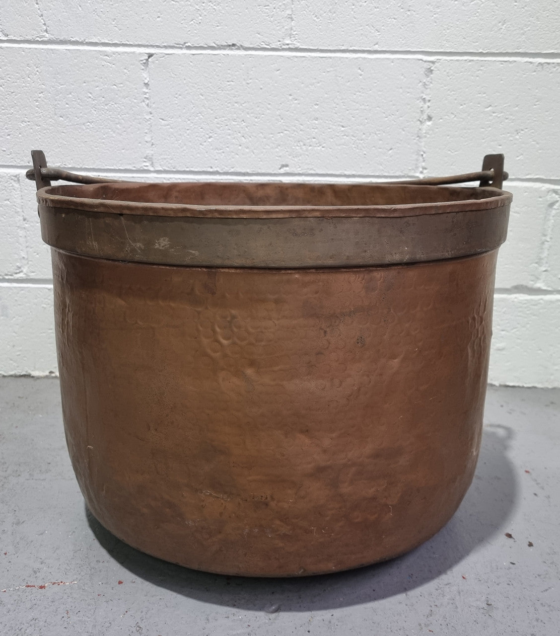 Large Antique French copper cauldron with metal band around rim. It is in good original condition.