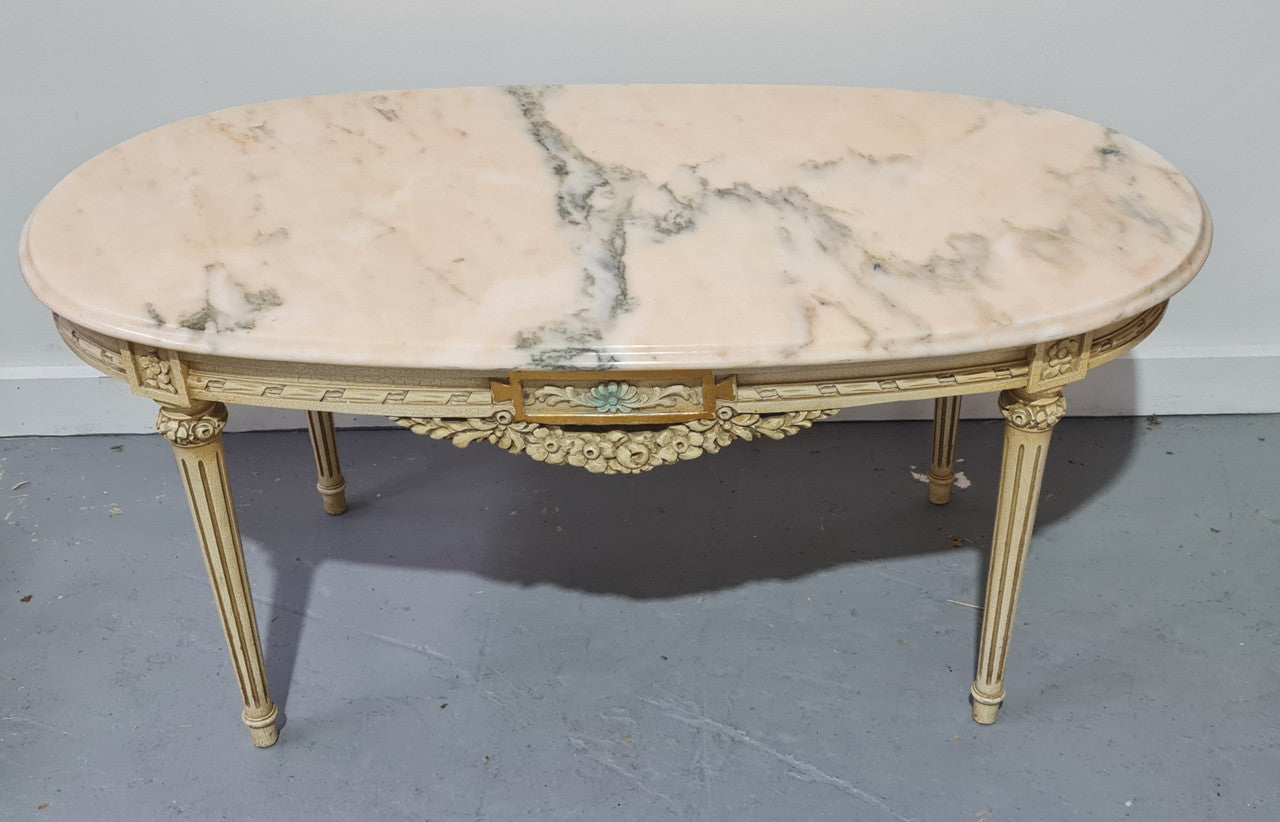 Charming painted Louis XVI style oval marble top coffee table. In good original detailed condition.