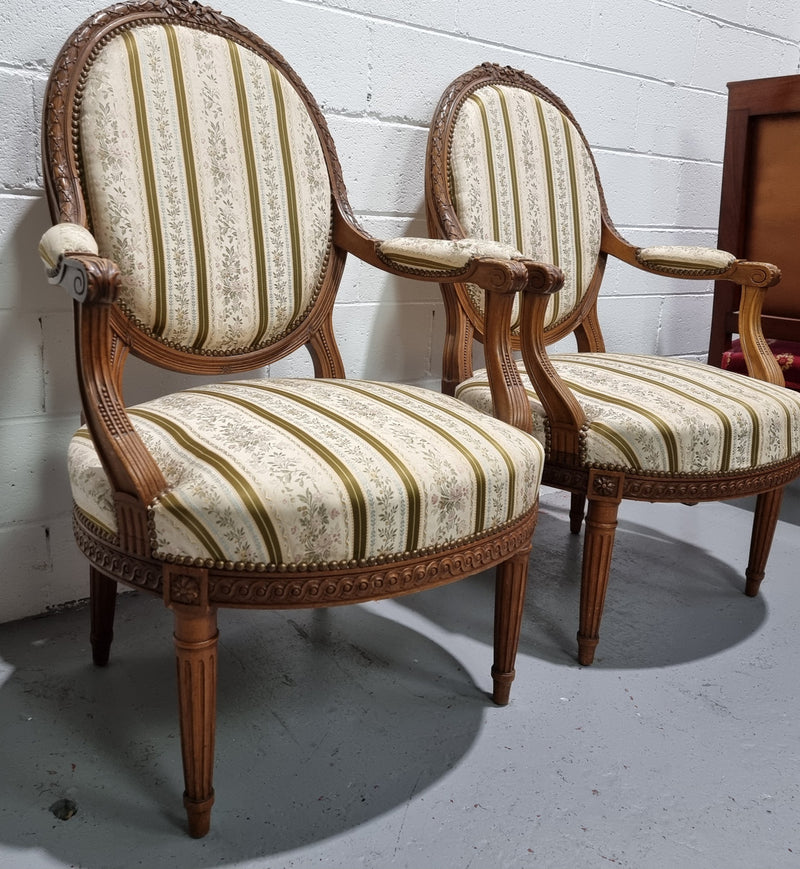 Pair of French Louis XV matching carved armchairs. They are in good overall condition with some slight wear to fabric, please view photos as they help form part of the description.