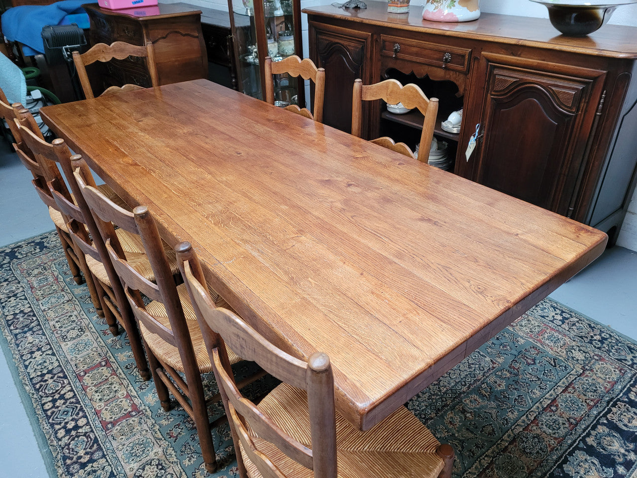 French Farmhouse table with a beautiful thick plank top and stretcher base. Can seat 8-10 people comfortably and is in good original detailed condition.