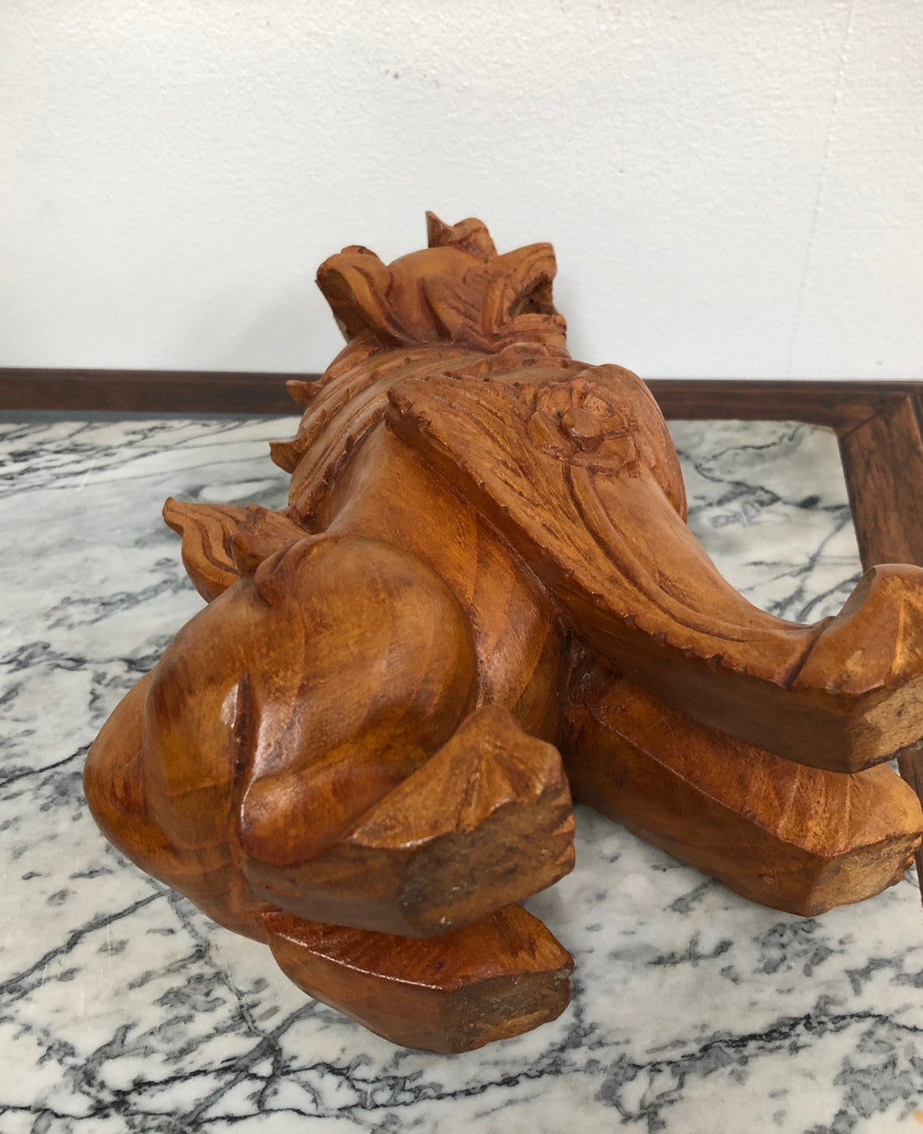 Chinese carved Teak Foo dog with very good detail. In good original condition.