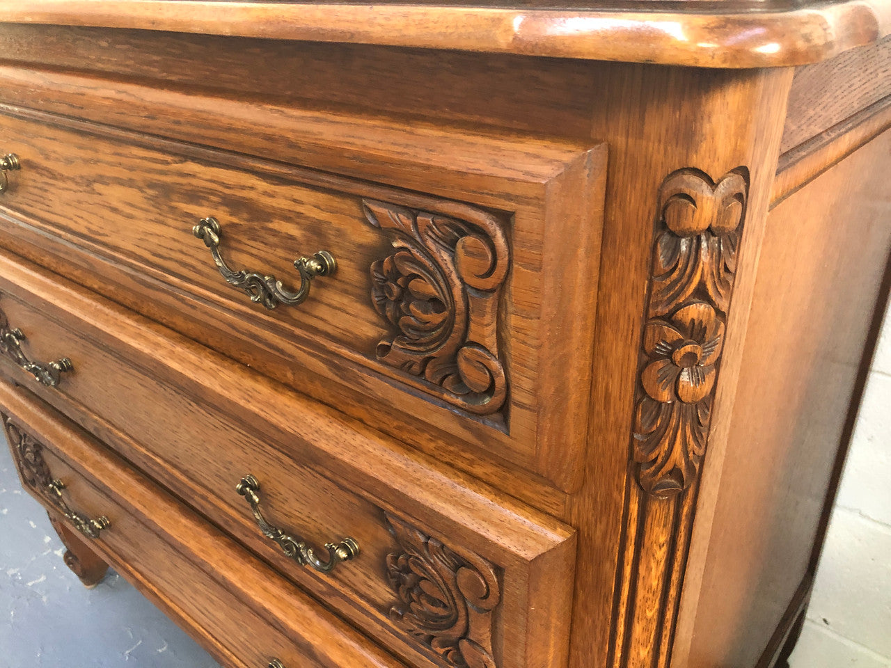 Gorgeous Provincial oak and parquetry top commode. It has beautiful carved Details and in good original detailed condition.