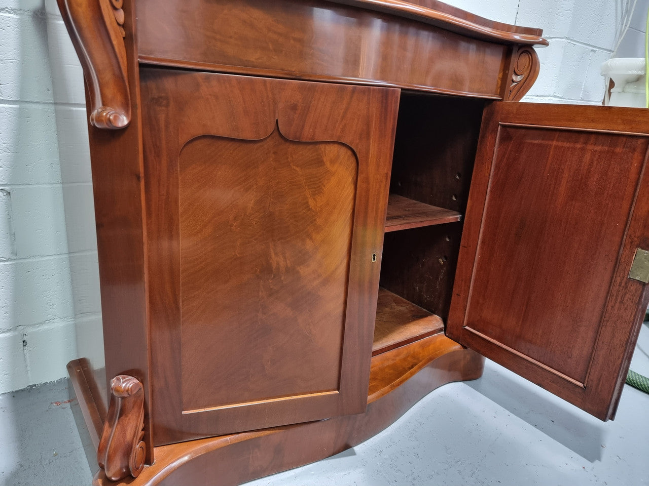 Beautiful Antique Victorian Mahogany two door Chiffonier. Plenty of storage space with one drawer and the two doors open up to a shelved area. It is in good restored condition.