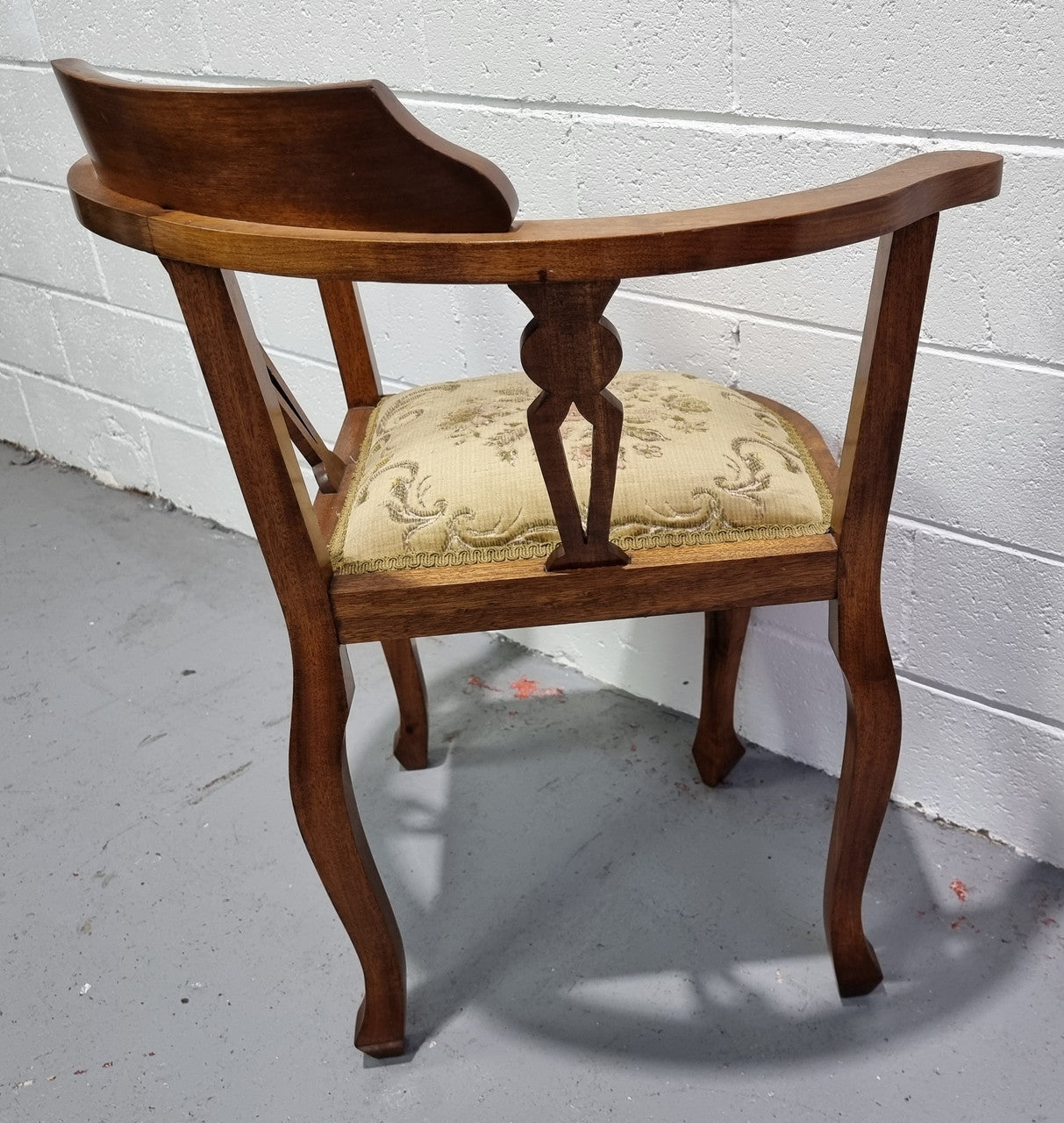 Mahogany upsholstered corner chair. It is in good original condition with clean upholstery.