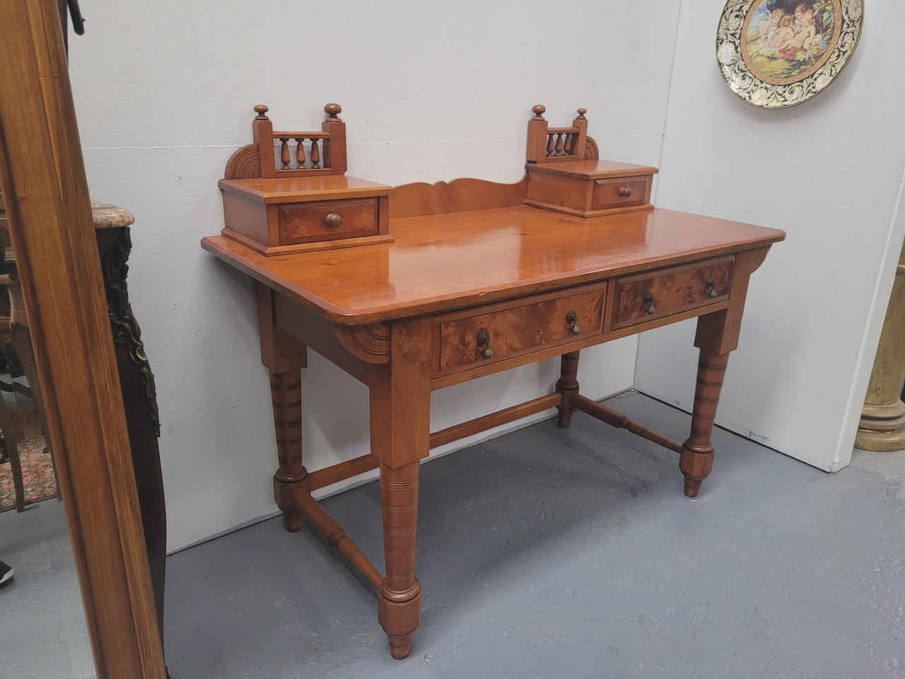 Late Victorian Huon Pine desk with two drawers. Featuring superb birdseye panels and is in good original detailed condition.