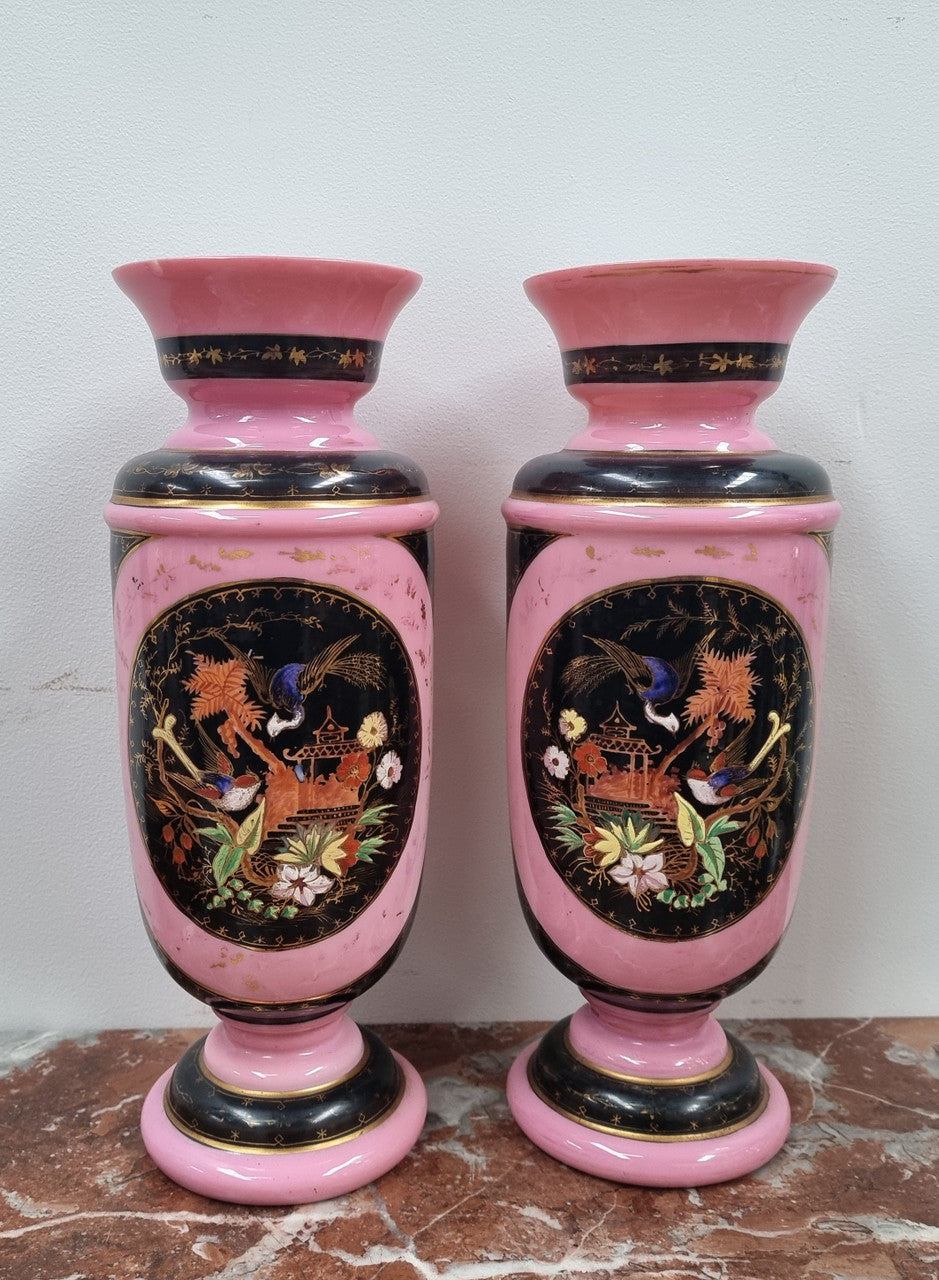 Late Victorian pink and hand painted, enameled pair of vases with some ware to enameling. It is in good original condition.