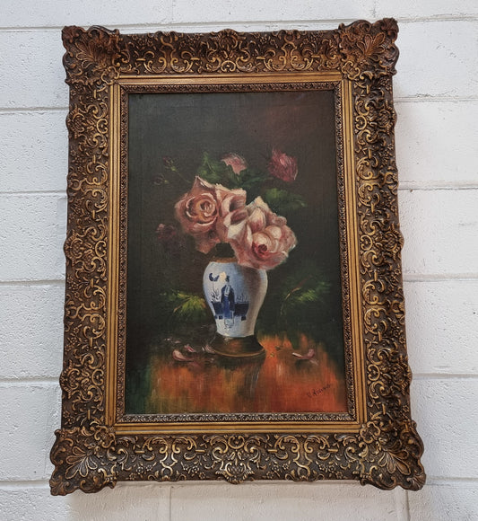 Stunning French signed floral oil on canvas painting of roses in a beautiful decorative frame and in good condition.