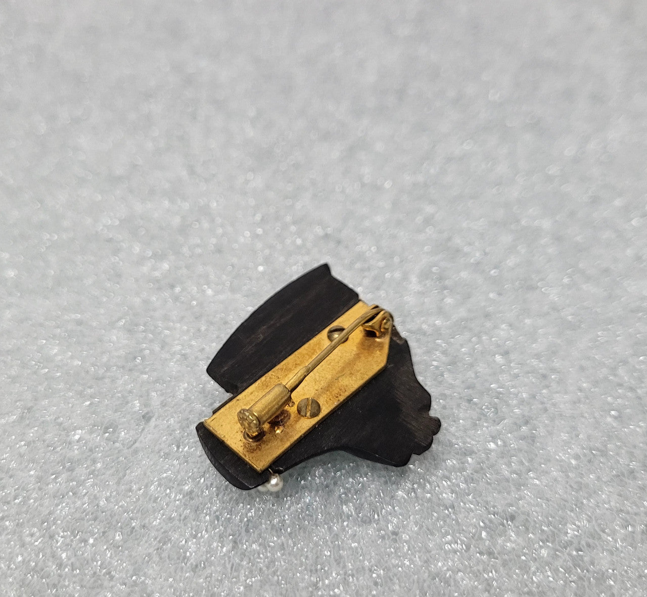 Lovely carved ebony and seed pearl African head brooch. It is in great original condition.