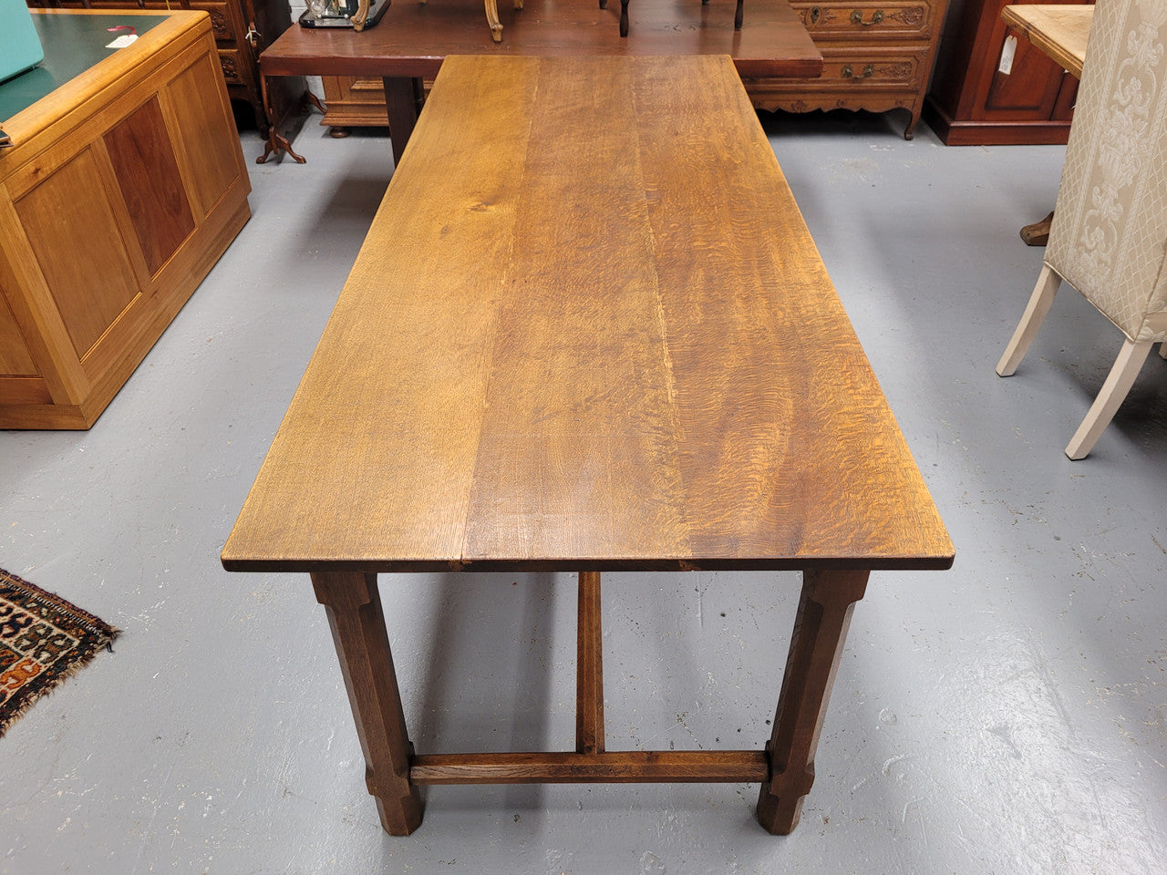 Stunning French oak stretcher base table, that has been sourced from France. It is in good original condition. Please see pictures to form part of the description.
