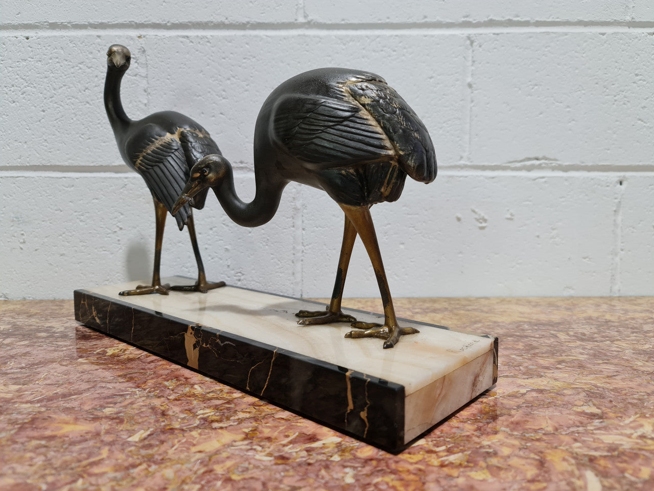 Fabulous French Art Deco cold painted spelter Ibis birds on a stylized Art Deco marble base. Signed "Rochard" circa 1930's. In good original detailed condition.