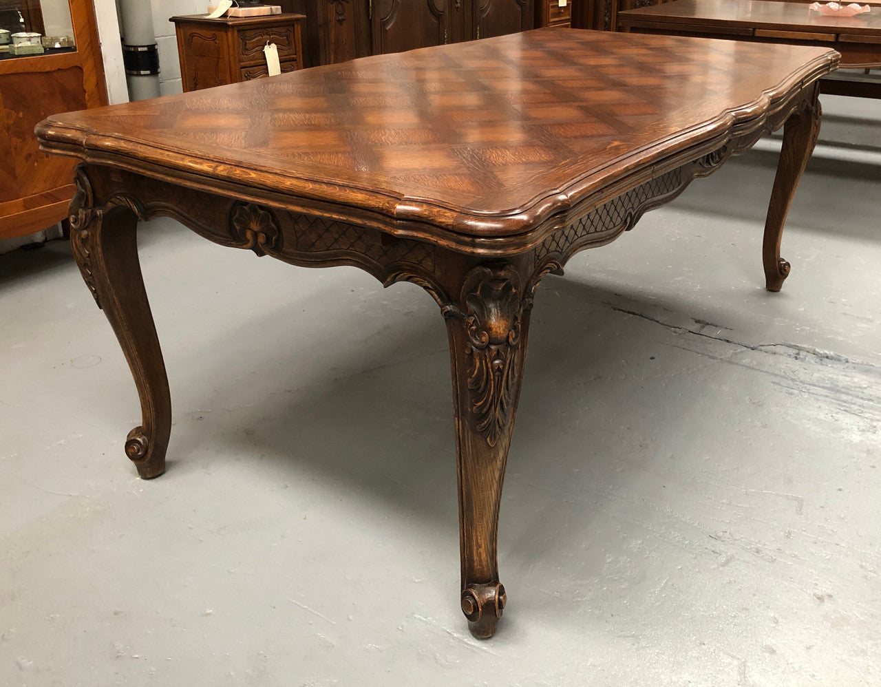 High quality French Oak Louis XV Style, beautifully carved extension table. It has an amazing parquetry top and when fully extended measures to 3 meters long. In very good original detailed condition.
