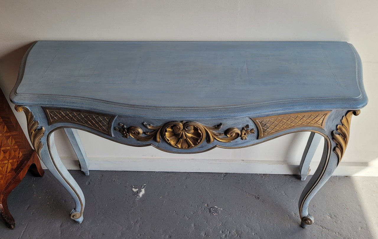 Stylish Louis 15th style console table with chalk paint and gilded highlights. They have been sourced from France and is in good original condition.