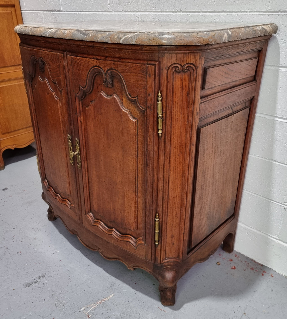 Rare 19th Century French Oak and marble top oval buffet / cabinet. Stunning thick marble top and decorative handles. In good original detailed condition.
