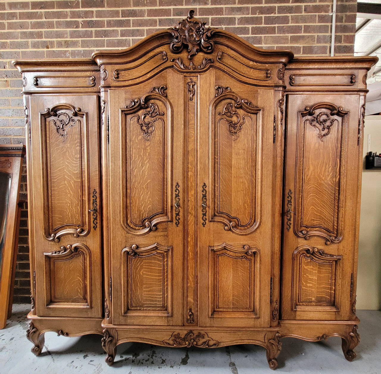 Amazing French Oak Louis XV style four door armoire. Plenty of storage space and beautifully carved throughout. In good original detailed condition and sourced from France. Please contact us for further photos.