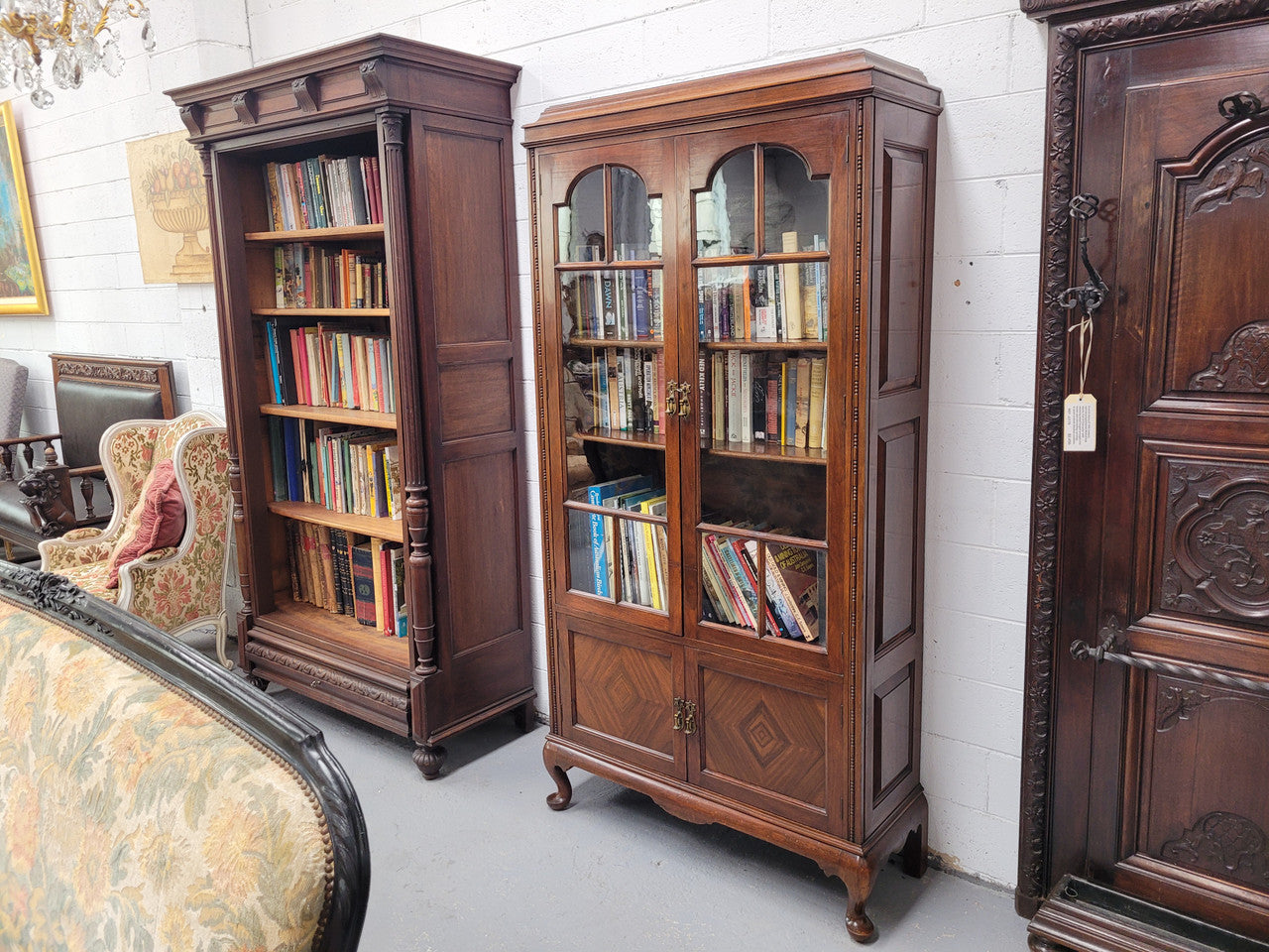 Beautiful four door Walnut bookcase with glass doors. The top section has two fully adjustable shelves and it is of pleasing narrow proportions. It is in good original detailed condition.