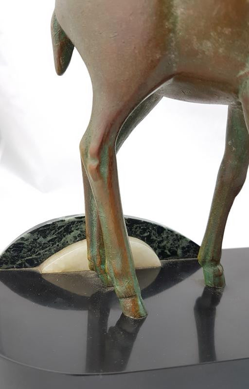 Absolutely gorgeous French cold painted metal Art Deco Statue of a lady and two deers on a marble base. Signed piece and in good original condition.