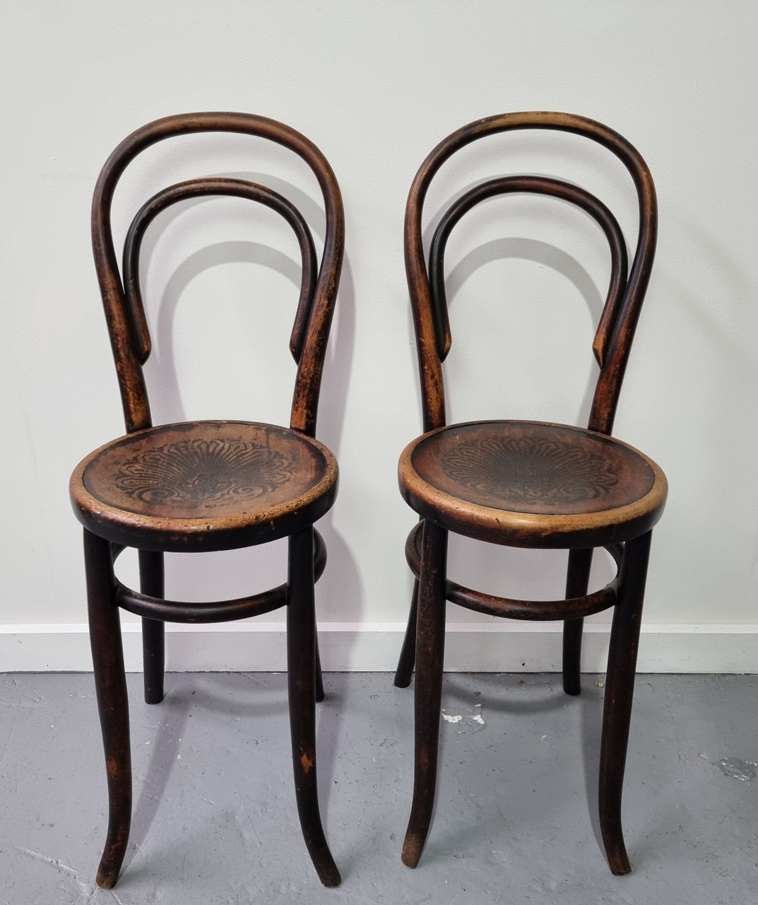 Rare petite cafe Bentwood chairs with original shell embossed seats. They are in very good original condition. They would make great addition to your breakfast bar.