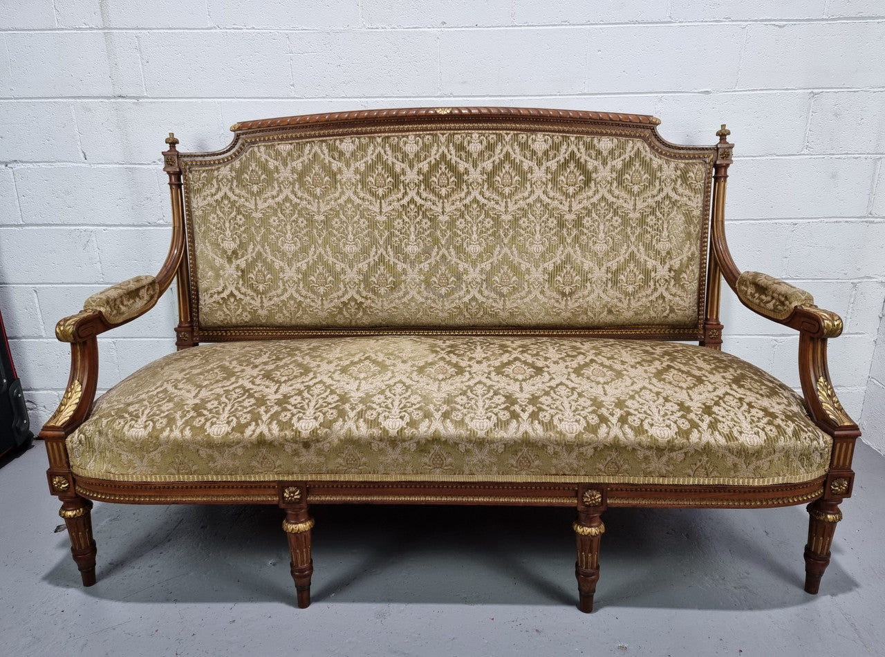 Beautiful French walnut Louis XVI style upholstered three piece Salon Suite. It has lovely fabric which is in overall good condition and is very comfortable to sit in. In good original detailed condition.