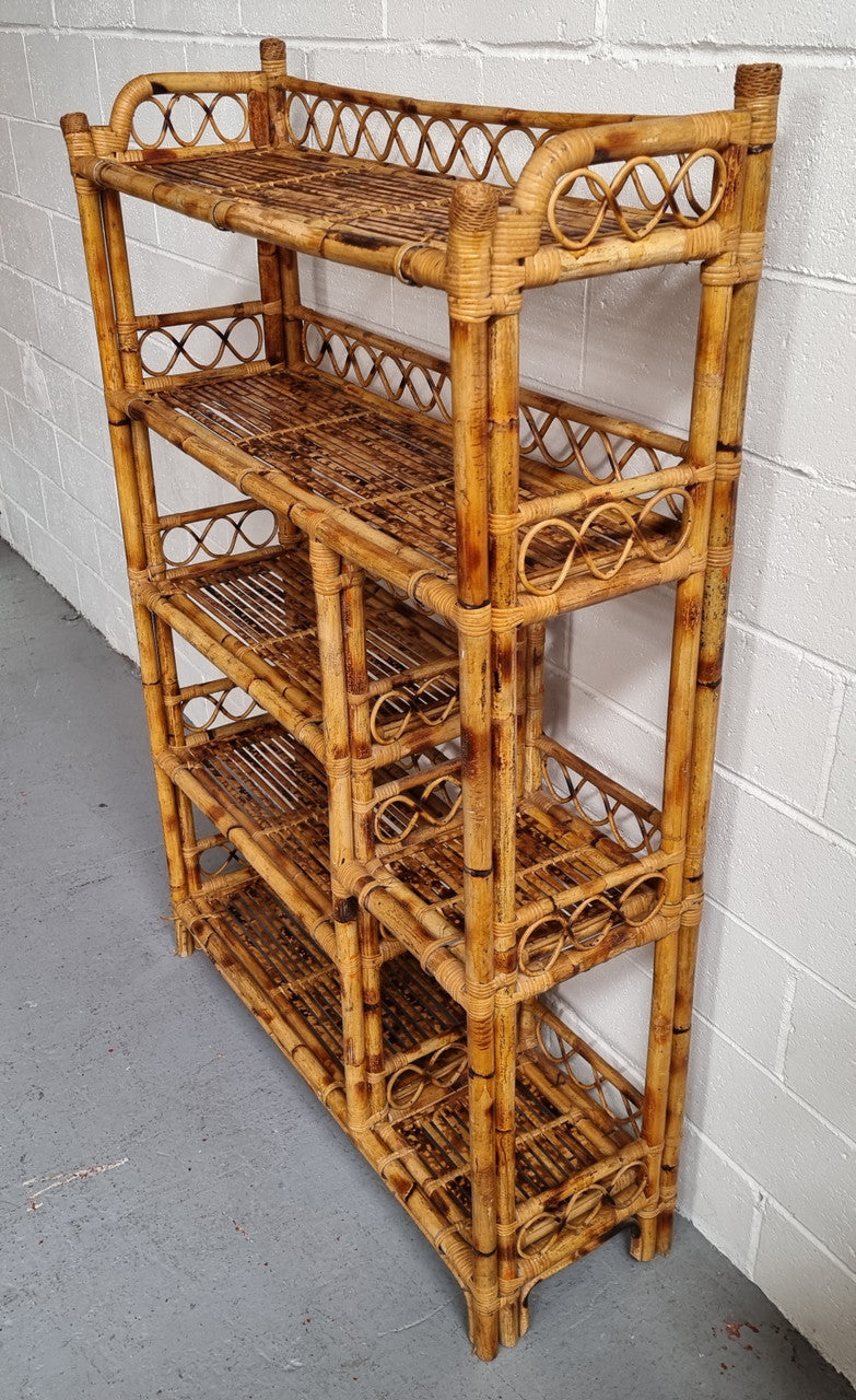 Vintage Tortoiseshell Bamboo Shelves. Good size unit with irregular shelves. It is in good original condition and it very solid.