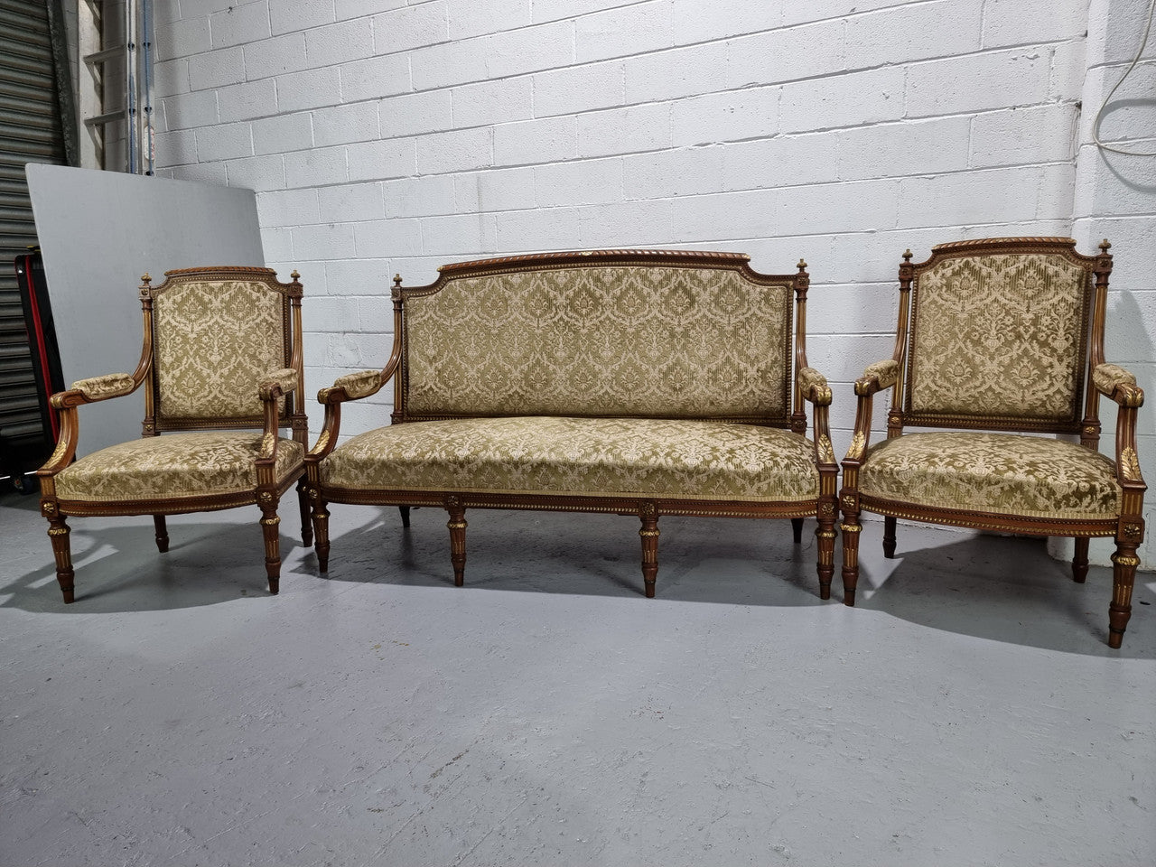 Beautiful French walnut Louis XVI style upholstered three piece Salon Suite. It has lovely fabric which is in overall good condition and is very comfortable to sit in. In good original detailed condition.