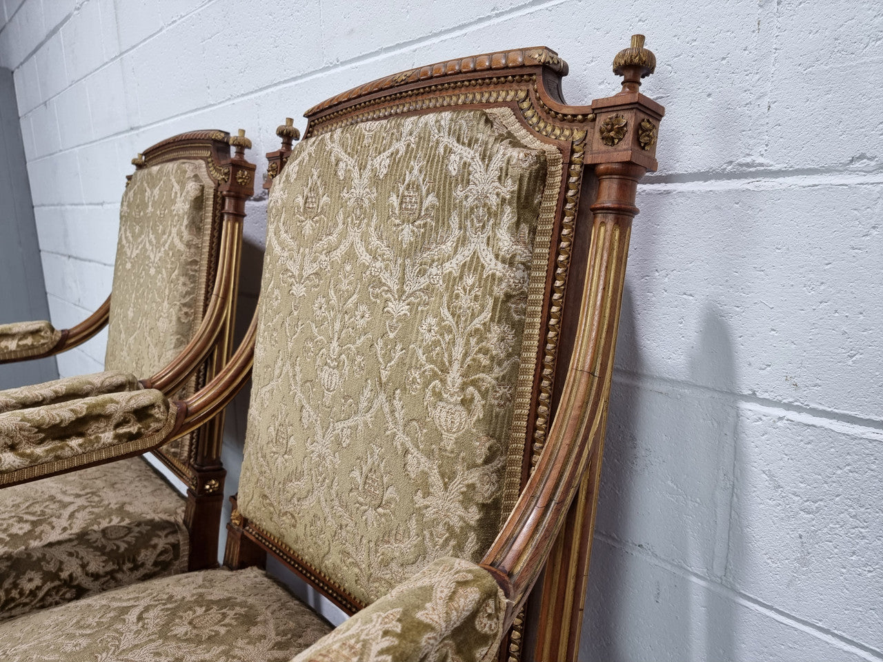 Beautiful French walnut Louis XVI style upholstered three piece Salon Suite. It has lovely fabric which is in overall good condition and is very comfortable to sit in. In good original detailed condition.