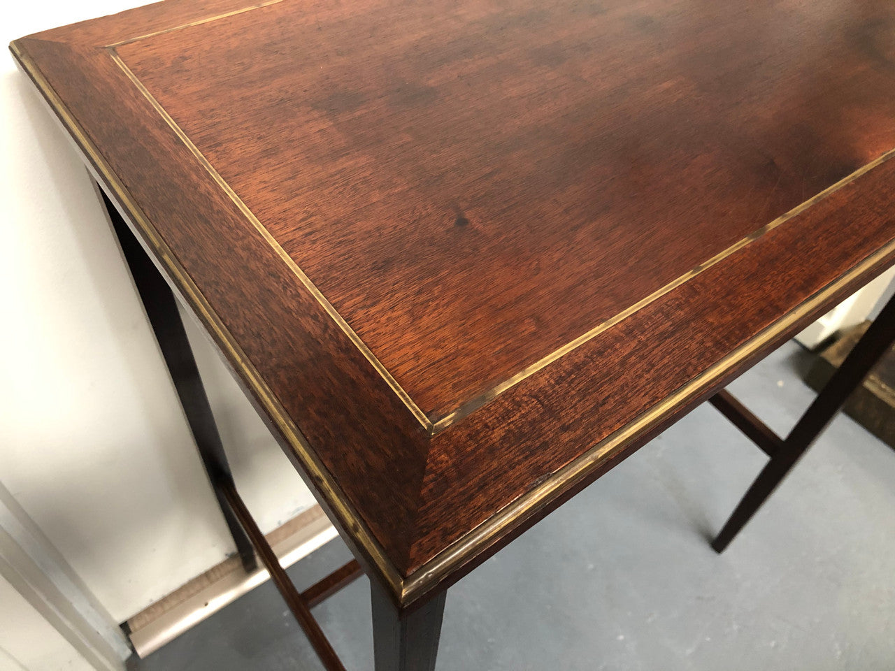 Elegant rectangular mahogany French brass inlaid occasional table. Is in good original condition.