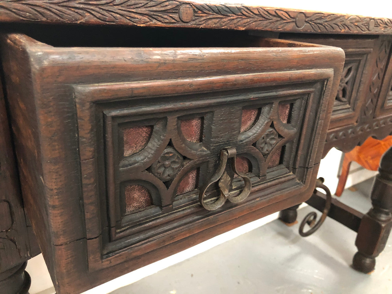 Spanish late 19th century carved oak three drawers console/side table. Superb wrought iron undercarriage. In good condition. Circa 1900's.