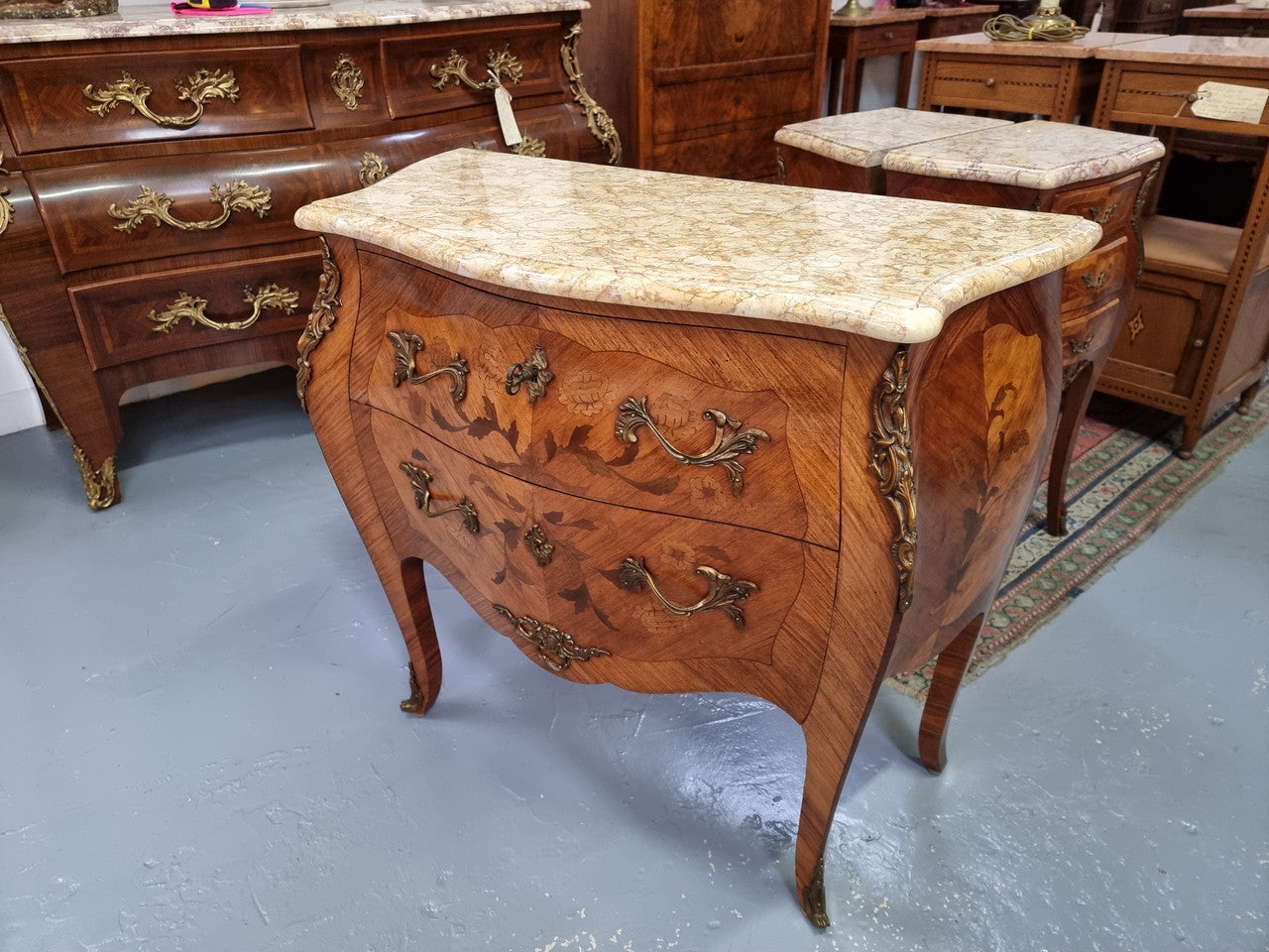 Fabulous French petite inlaid two drawer commode with ormolu mounts and lovely marble top. It is in good original detailed condition.