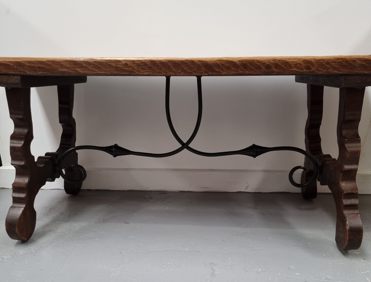 Charming French rustic Spanish style coffee table. It has an amazing rustic top and beautiful iron work. Sourced from France and is in good original detailed condition.