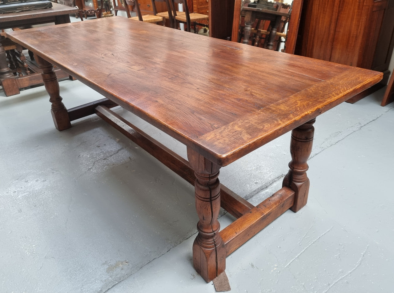 Vintage French Oak stretcher base farmhouse table. It is in good original condition.