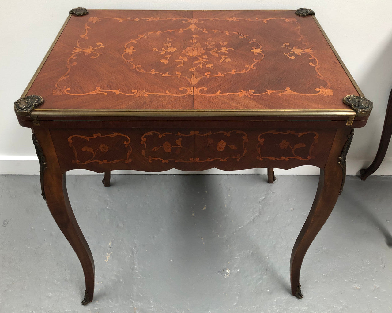 Beautiful french inlaid games table which includes internal drawers and bronze mounts. Internal drawers have counters and cards included.