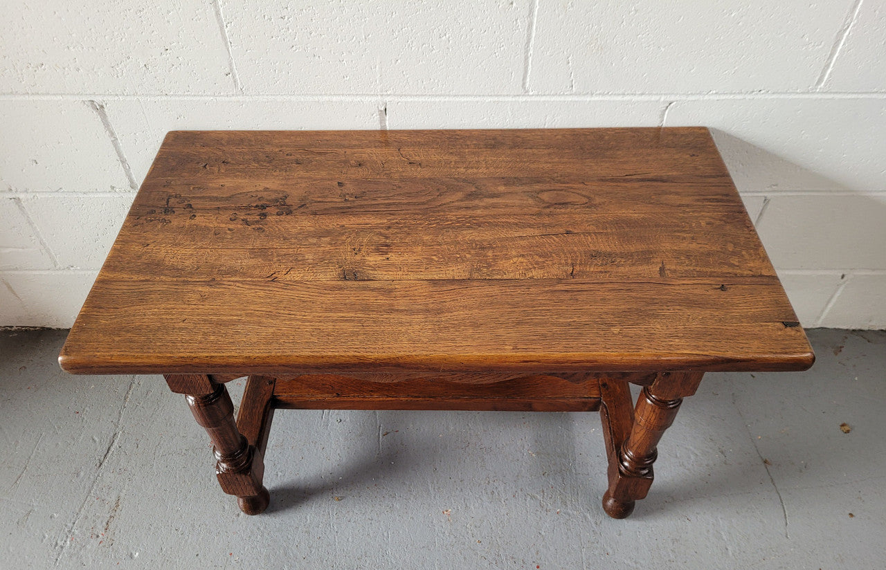 Small French Oak rustic coffee table. Perfect size for a small area and it is in good original detailed condition.