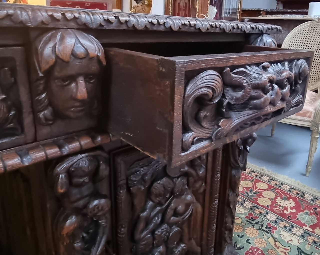 Beautifully carved French Oak early 19th century pedestal desk with 3 drawers, two cupboards and a secret cupboard on the side. There is also a lovely burgundy tooled leather top. In good original detailed condition.
