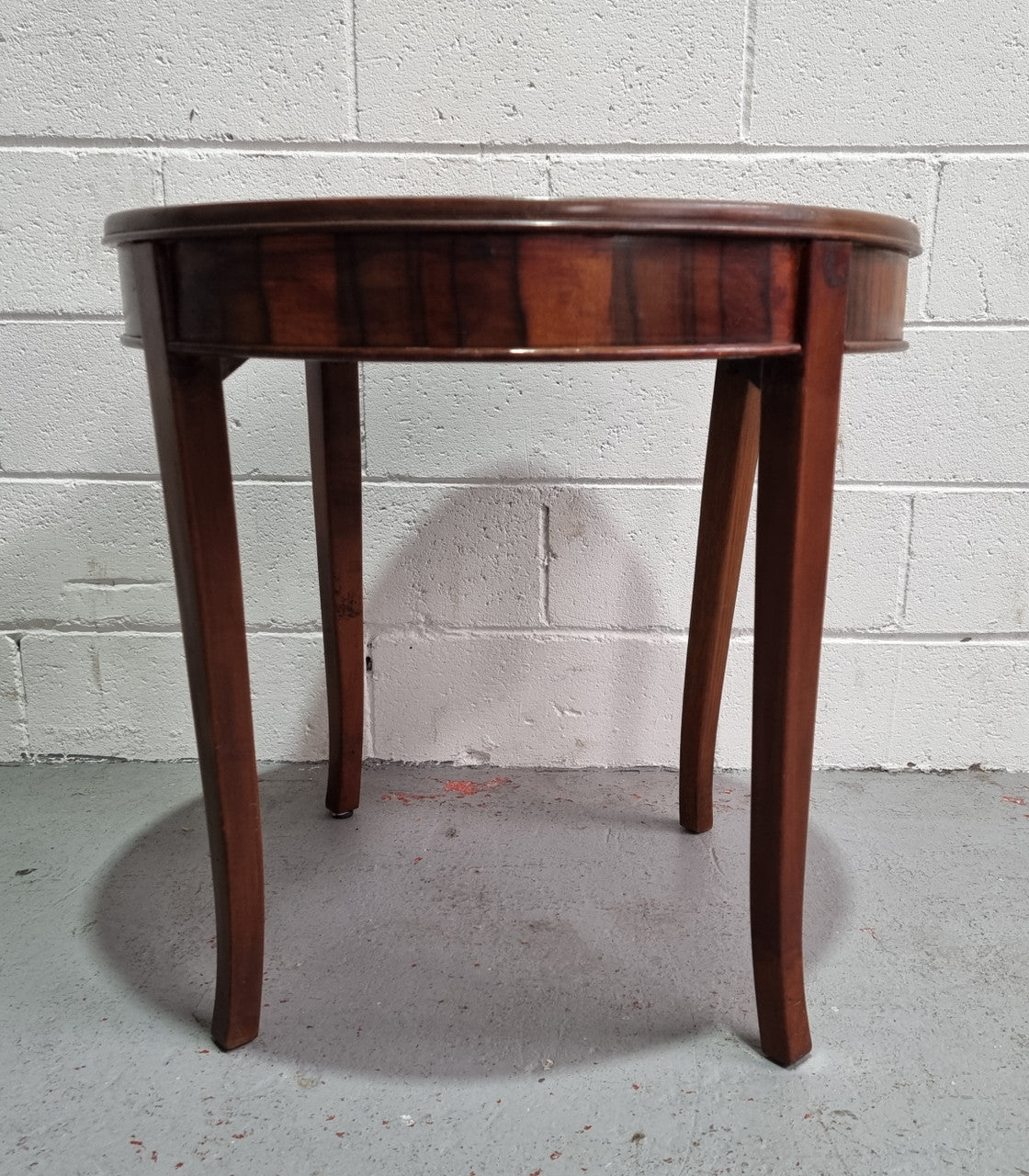 Round Art Deco Coffee Table with veneered top. In good original condition.