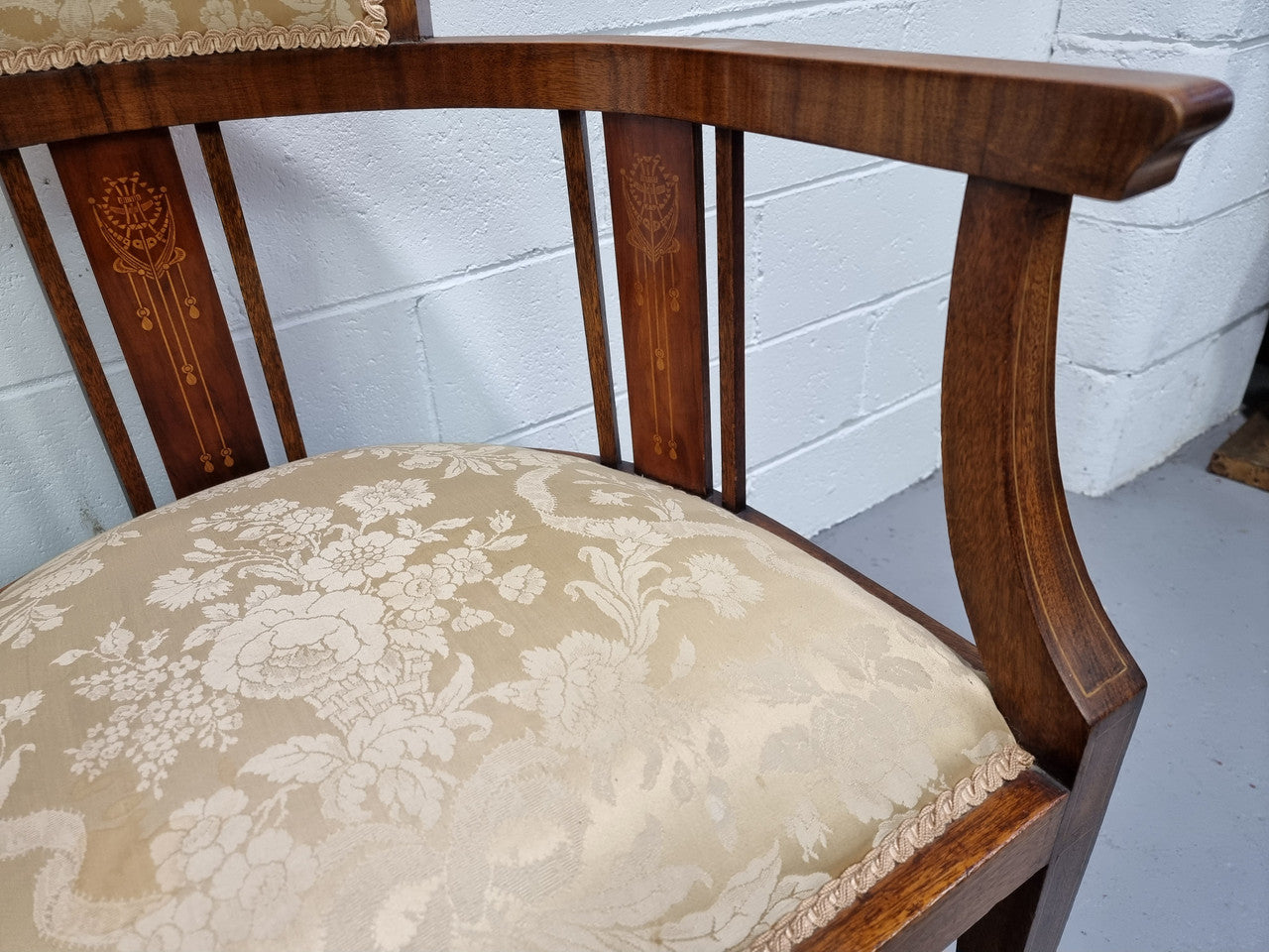 Charming Edwardian inlaid walnut upholstered armchair. In good original condition.