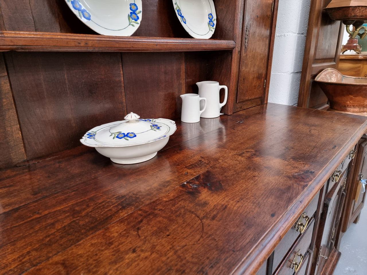 18th Century English Oak Farmhouse dresser of grand proportions. It was sourced in France and not only looks amazing but also has plenty of practical storage space. It is in good original detailed condition.