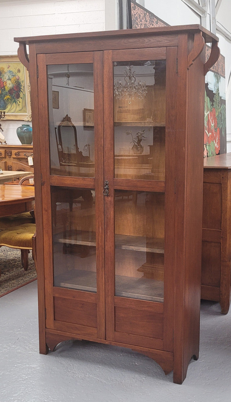 Beautiful two door Blackwood bookcase with glass doors and with four fully adjustable shelves. It is in good original detailed condition.