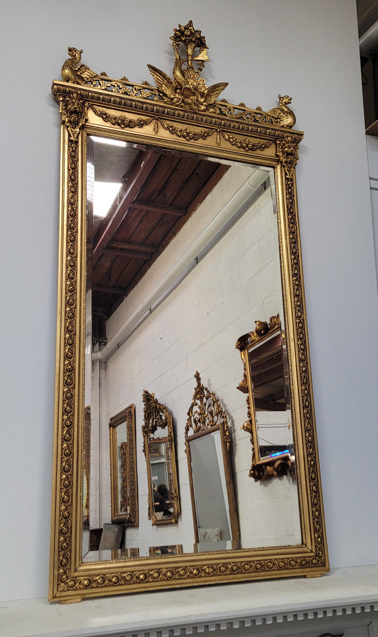 Impressive French Napoleon III water gilded mantle mirror. It is beautifully decorated with allegorical themes and has been sourced from France. In good original detailed condition with original mirror.