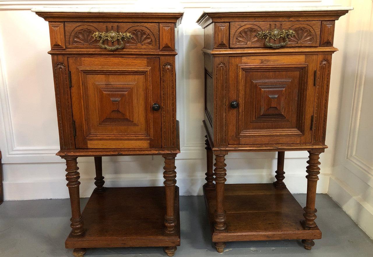 Pair of French Oak Arts and Crafts bedsides cabinets with lovely Carrara marble top and drawer and cupboard for storage. In good original detailed condition.