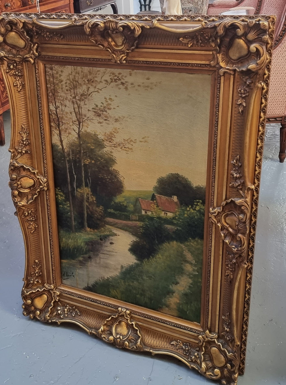 Lovely signed landscape river scene oil on canvas framed in a beautiful ornate frame and in good original condition.